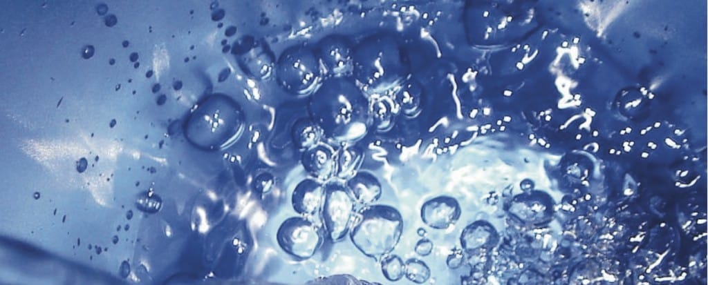 Bubbles in container full of water.